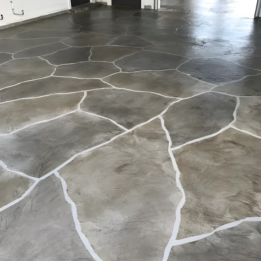 Close view of a hand-finished flagstone-style decorative concrete surface.