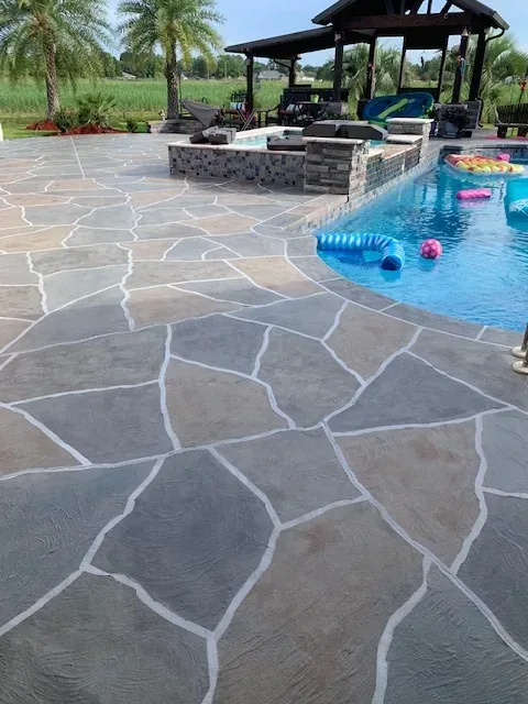 Flagstone pool deck overlay by Decorative Concrete of South Louisiana.