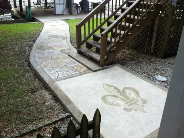 Fleur-de-lis stencil walkway by Decorative Concrete of South Louisiana.
