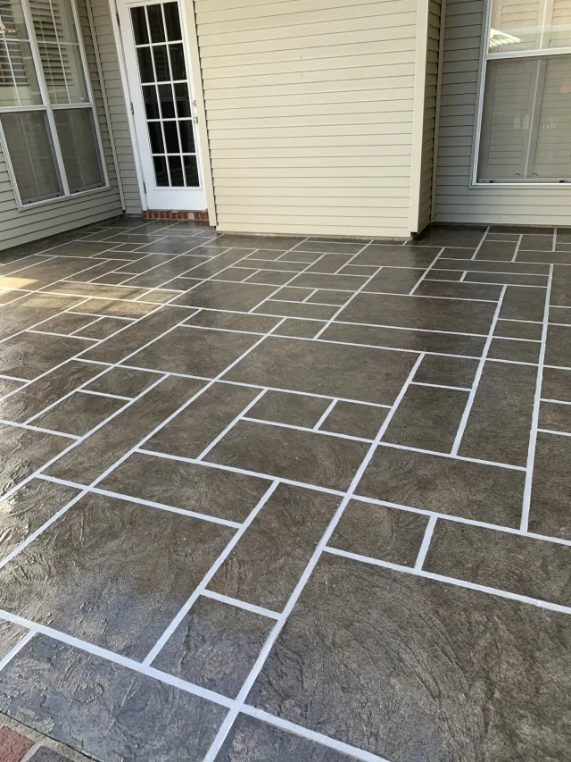 Gray ashlar overlay on a back porch by Decorative Concrete of South Louisiana.