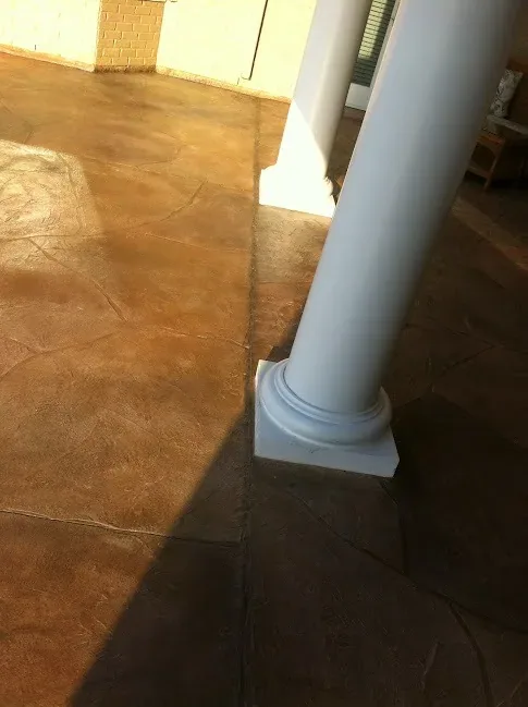 Stained overlay on a front porch by Decorative Concrete of South Louisiana.