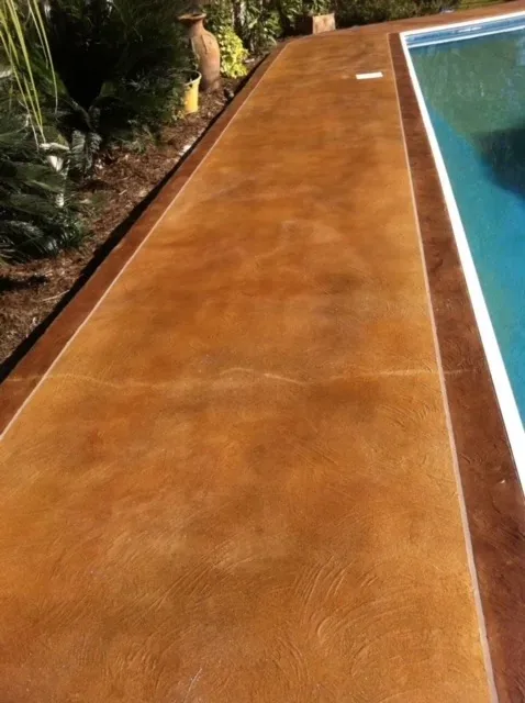 Stained pool coping by Decorative Concrete of South Louisiana.