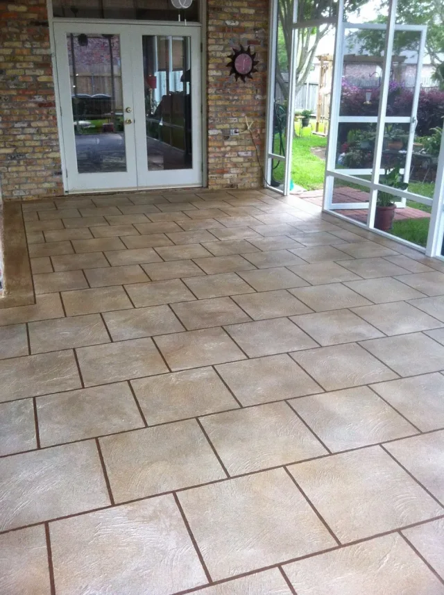 Tan tile-pattern patio overlay by Decorative Concrete of South Louisiana.