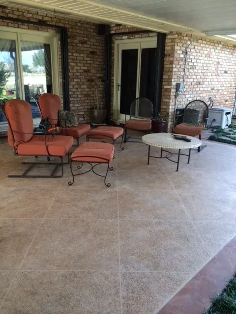 Textured overlay on a covered patio by Decorative Concrete of South Louisiana.