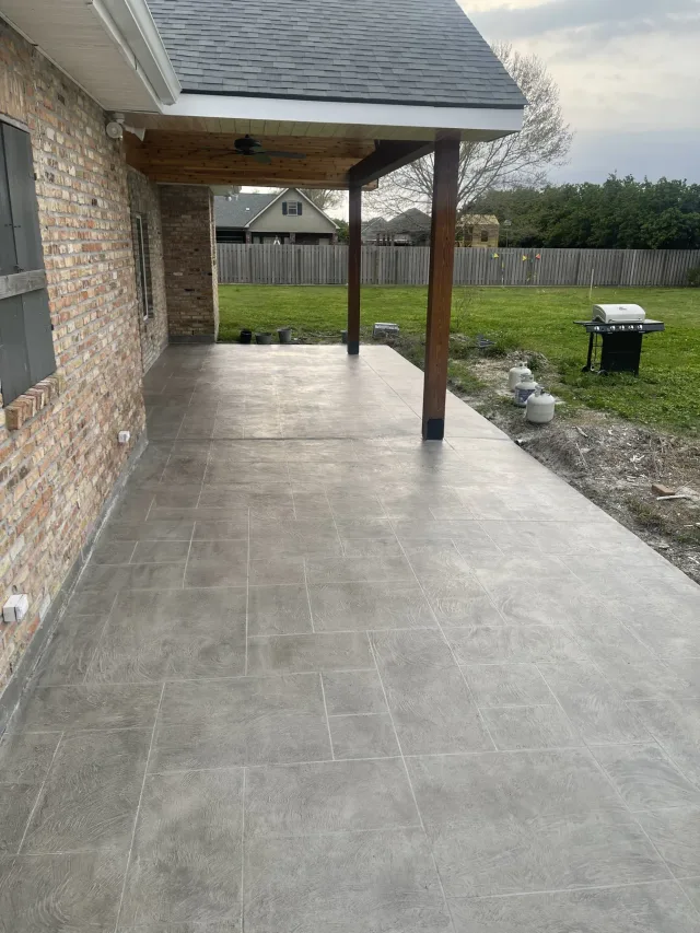Ashlar slate covered porch by Decorative Concrete of South Louisiana.