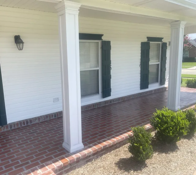 Brick-Inspired Front Porch Resurfacing by Decorative Concrete of South Louisiana.