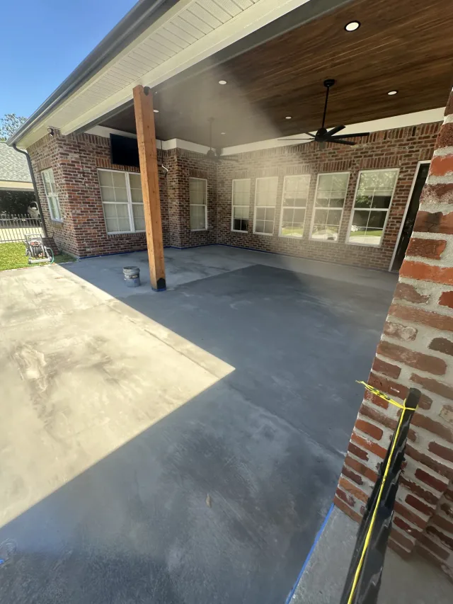 Patio during the work, with the large-format layout going down.