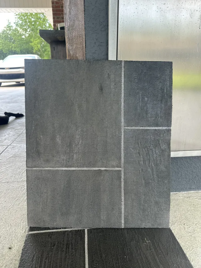 Sample board showing the charcoal large-format ashlar slate finish.