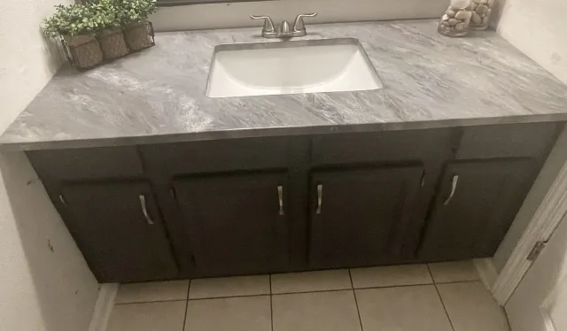 Custom concrete vanity by Decorative Concrete of South Louisiana.