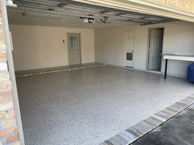 Garage full-flake floor by Decorative Concrete of South Louisiana.