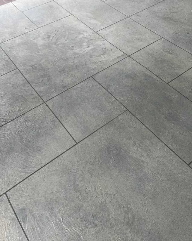 Ashlar Slate Covered Patio by Decorative Concrete of South Louisiana.