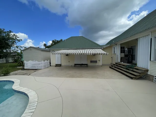 Light Knockdown Pool Deck by Decorative Concrete of South Louisiana.