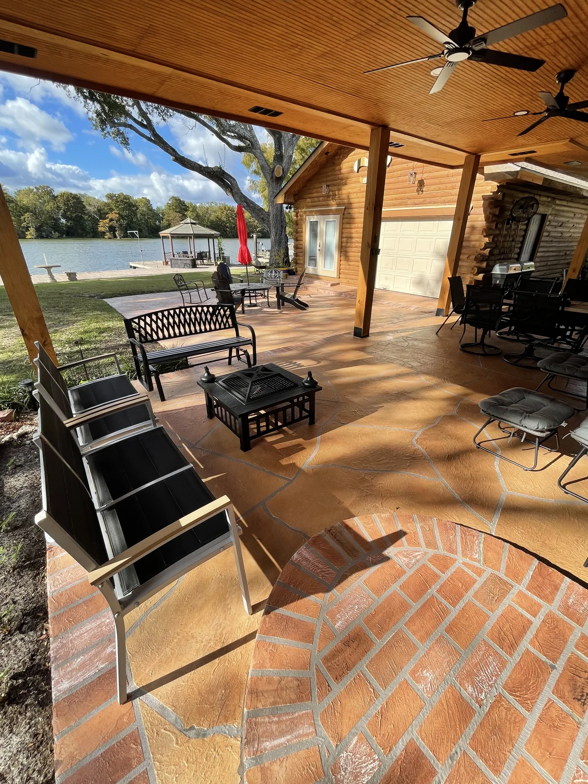 Finished outdoor living area with decorative concrete patio.