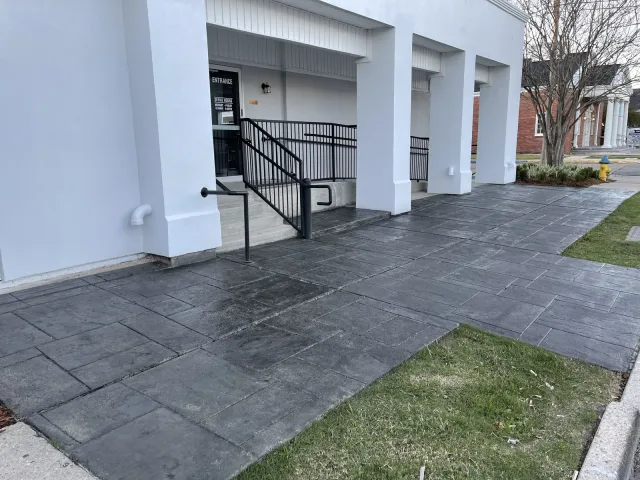 Charcoal walkway at a medical practice by Decorative Concrete of South Louisiana.