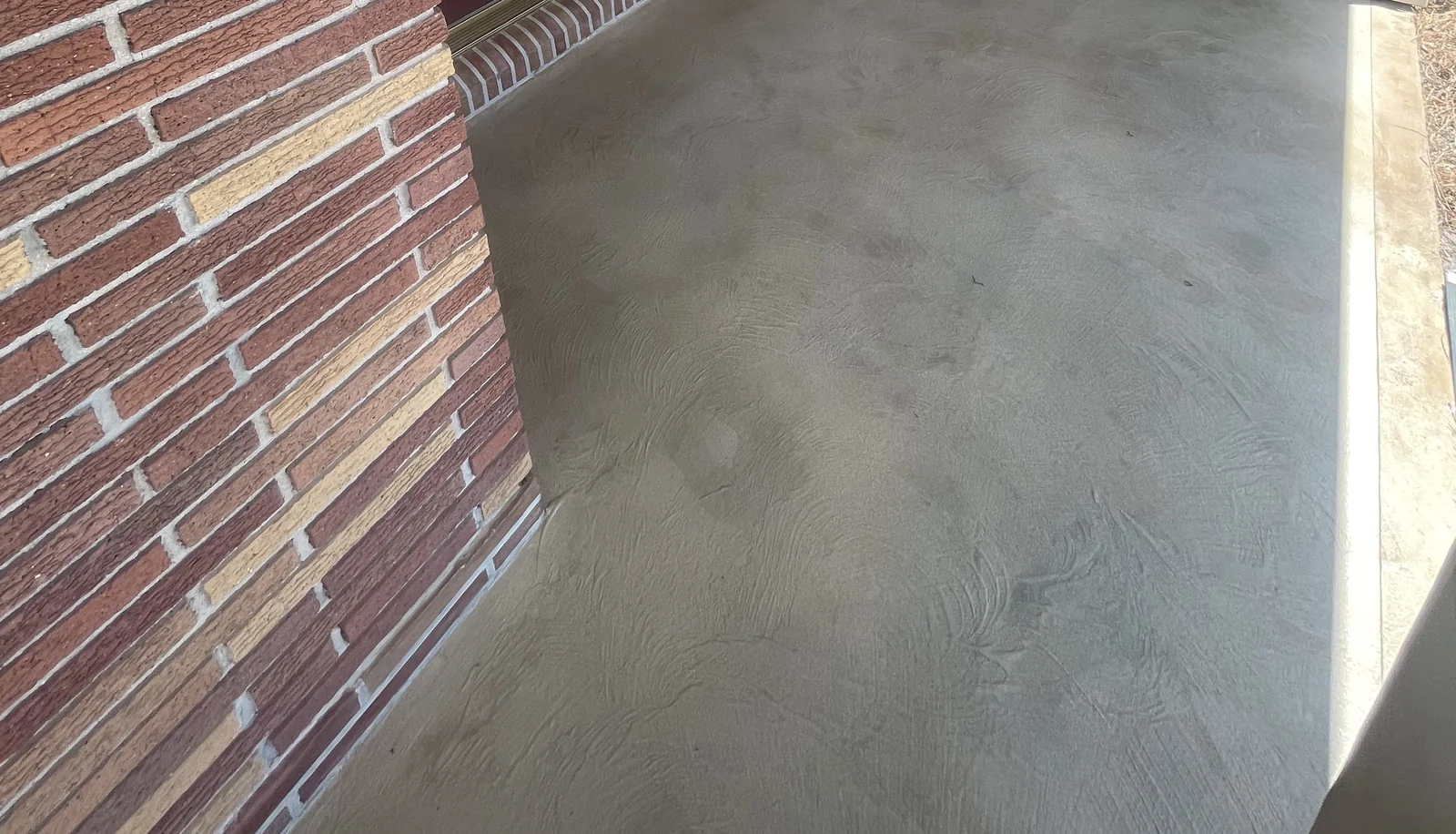 Continuous decorative overlay on a front porch.