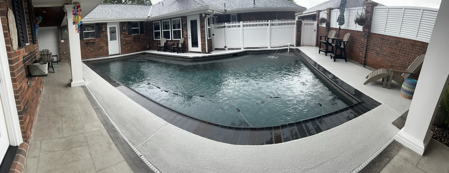 Finished deck around the pool, seen from the covered patio.