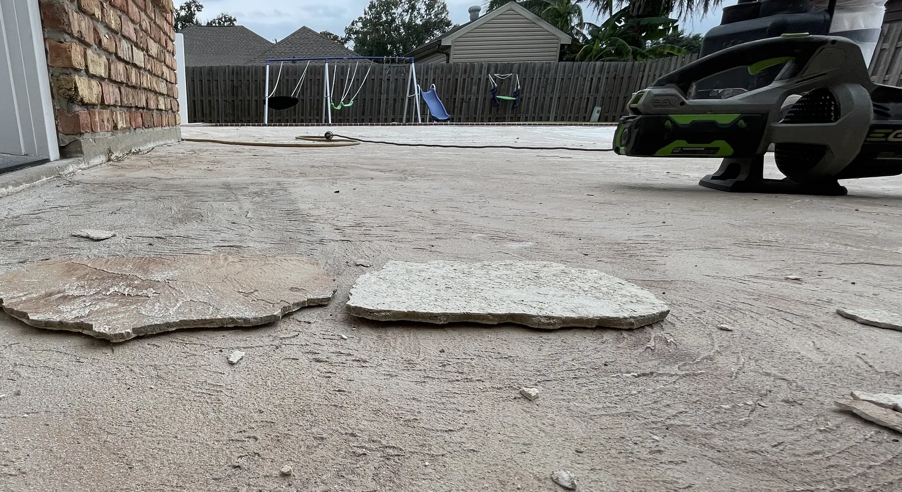 Existing pool deck finish being removed during a DCOSL resurfacing project.