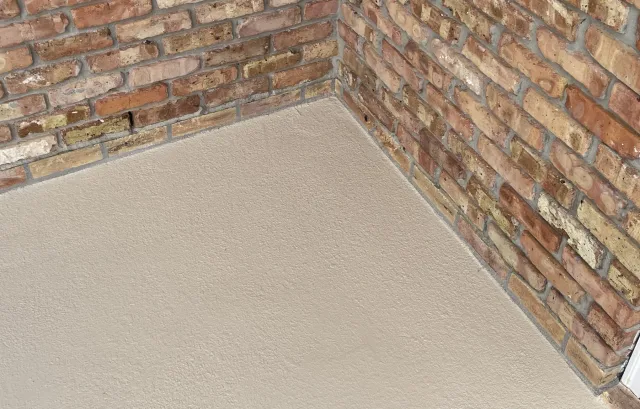 Close view of the actual light textured finish at the brick corner.