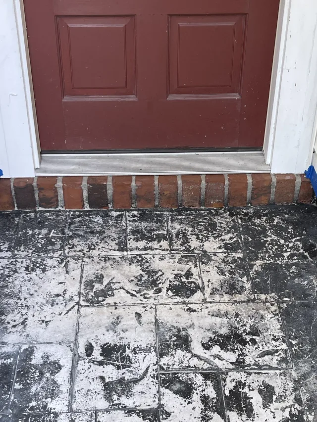 Peeling and worn surface at the same front door before the refresh.