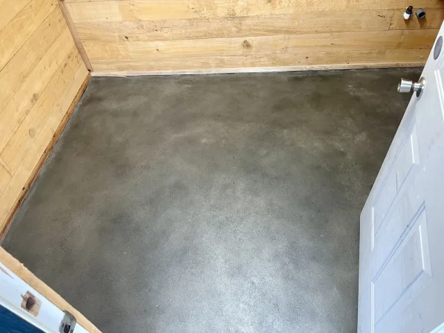 Stained concrete utility room by Decorative Concrete of South Louisiana.