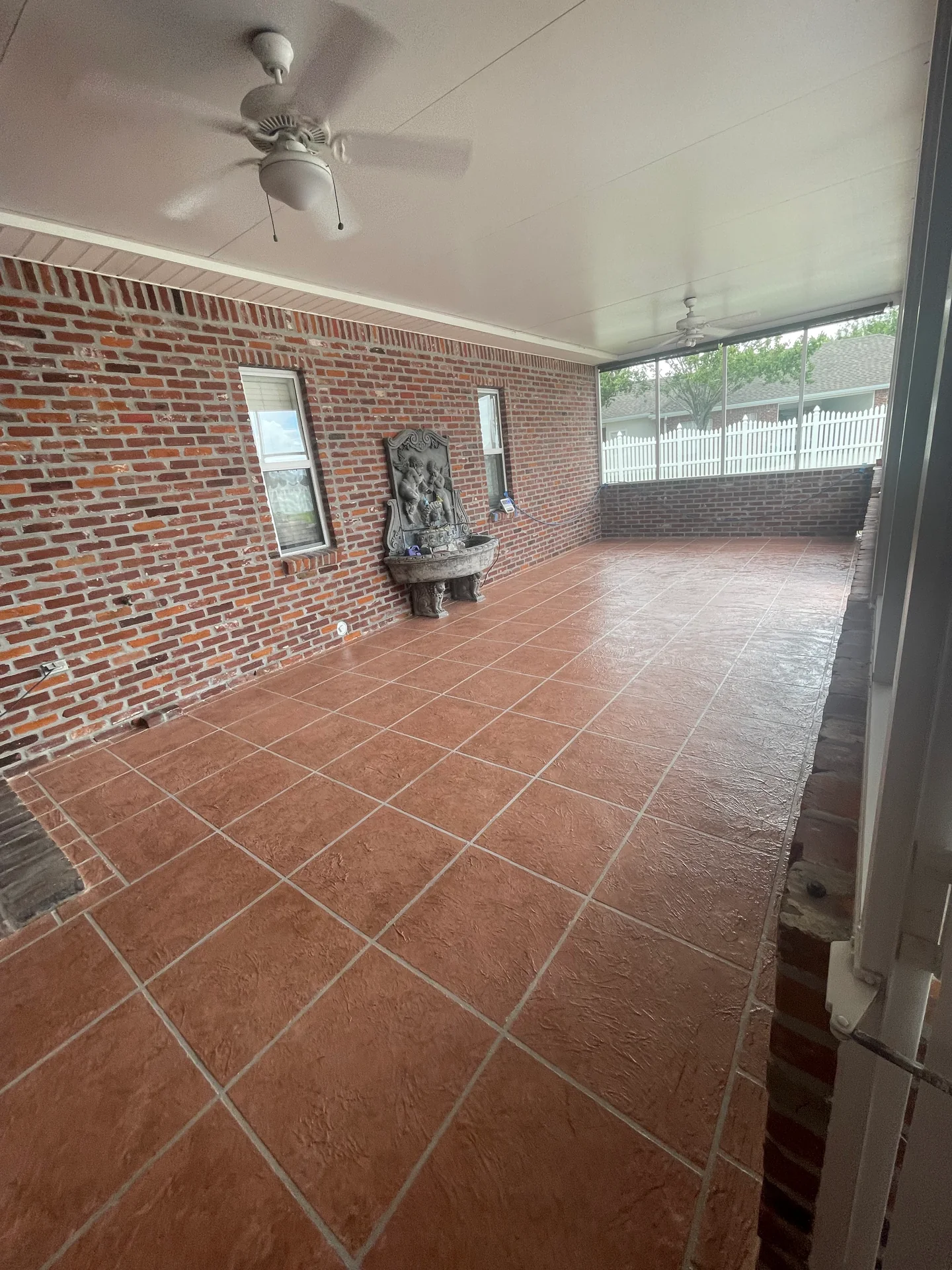 Tile-pattern decorative concrete overlay in an outdoor living space.