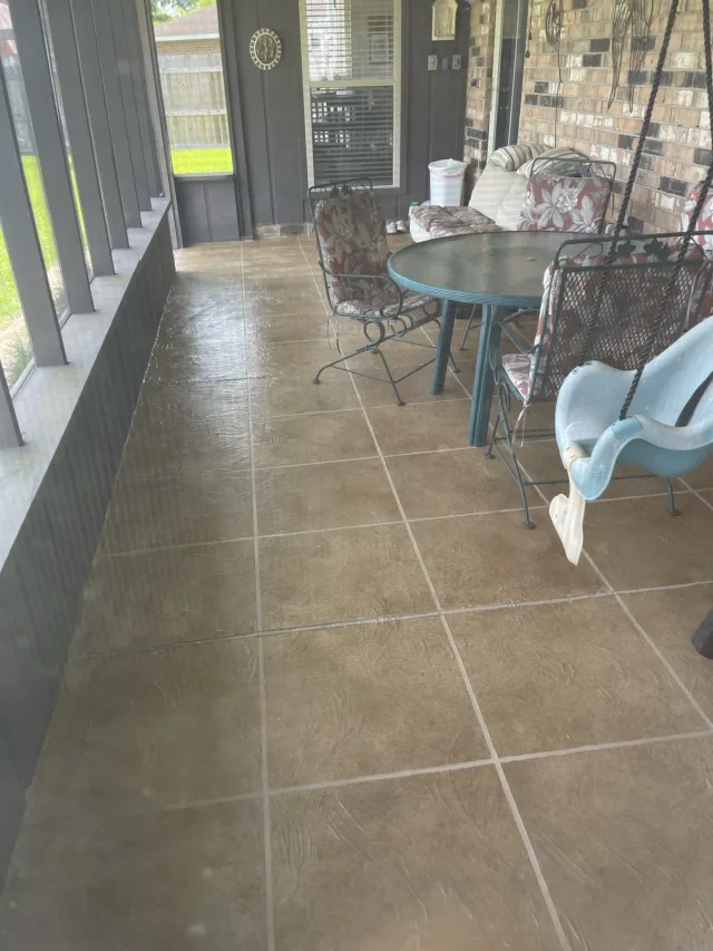 Tile-pattern screened porch by Decorative Concrete of South Louisiana.