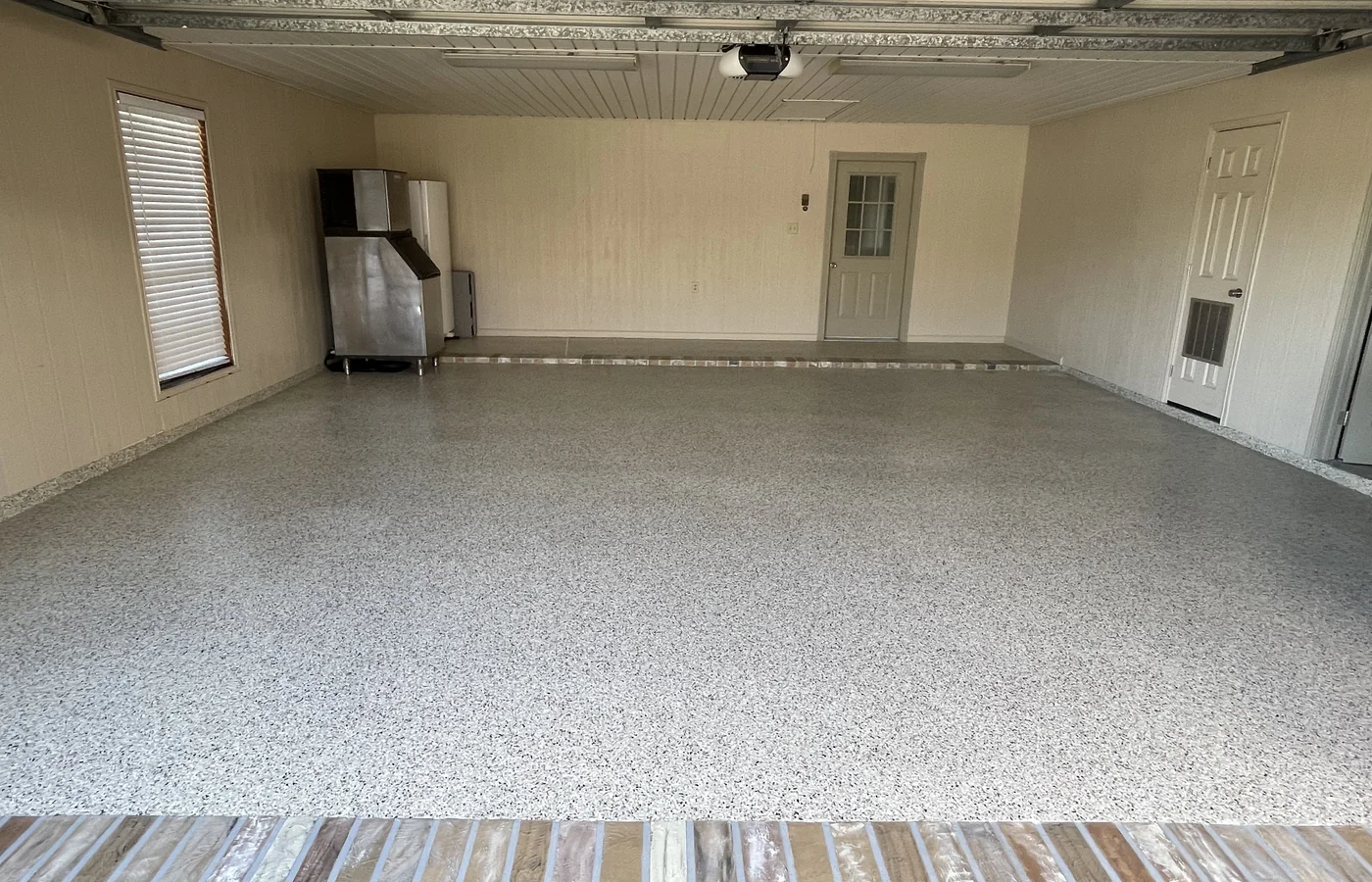 Finished flake-coated residential garage floor.